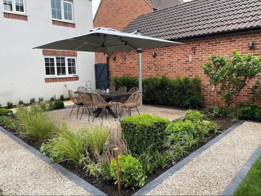 Planted courtyard garden with gravel paths and seating