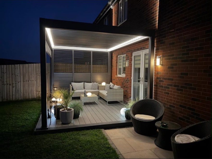 Illuminated modern pergola and composite deck at night