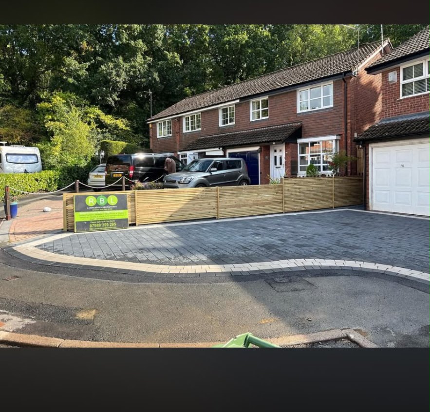 Block paved driveway with timber fencing